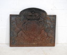 A cast iron fireback, depicting a coat of arms - length 59cm, height 51cm