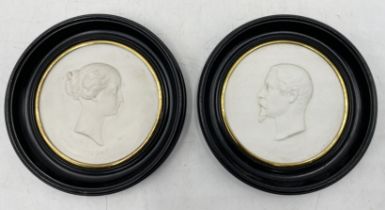 A pair of 19th century bisque plaques depicting Napoleon III and Princess Eugenie inscribed J Peyre,