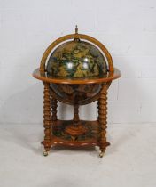 A reproduction drinks globe, raised on barley-twist supports - diameter 70cm, height 100cm