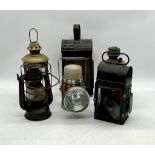 A collection of vintage lamps including a kerosine and railway lamp etc