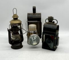 A collection of vintage lamps including a kerosine and railway lamp etc