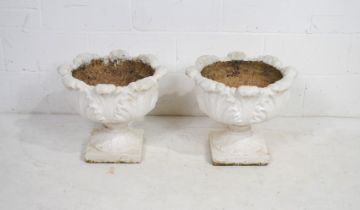 A pair of white painted reconstituted stone garden urns - diameter 50cm, height 43cm