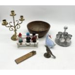 An assortment of items including brass candle stick, novelty bottle stopper set, brass bird etc.