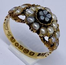 An 18ct gold mourning/memorial ring set with seed pearls, engraved to inside "In loving memory M A