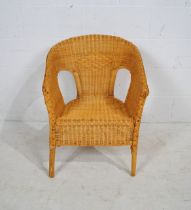 A wicker tub chair