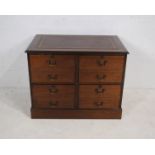 A mahogany chest of four lockable filing drawers (with keys), with brown leather inset top -