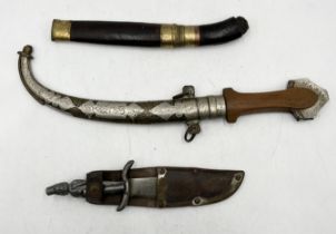 A collection of three knives including Eastern dagger in decorated sheath