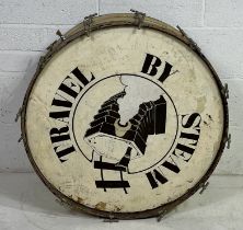 A marching band bass drum, with "Travel by Steam" on one side. 77cm x 38cm