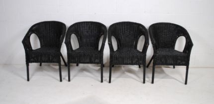 A set of four Ikea black wicker garden tub chairs