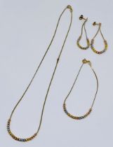 A 9ct gold necklace, matching bracelet and earrings, total weight 4.5g