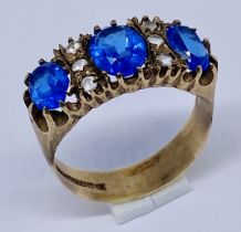 A Victorian style ring with blue stones and diamond infills set in 9ct gold, total weight 4.1g, size