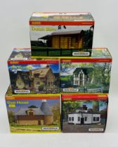 Five boxed Hornby Skaledale OO gauge buildings including Old Toll House (R8754), Oast House (R8568),