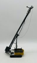 An unboxed NZG Liebherr LRB 255 piling & drilling rig die-cast model