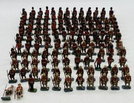 A collection of plastic toy figurines including Scottish Highlanders Riflemen, Scots Guards etc -
