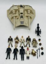 A collection of Star Wars figurines including Darth Vader (dated 1977), Luke Skywalker, Princess