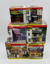 A collection of six boxed Hornby Skaledale OO gauge shops including The Model Shop (R9753), Harold's