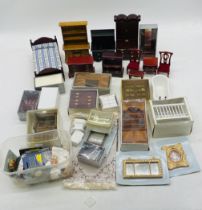 A collection of vintage dolls house furniture and accessories including bed, chest of drawers,