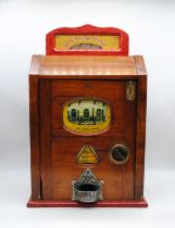 A Brenners 'Roll Out The Barrel' mahogany cased three drum penny slot machine, with key - untested -