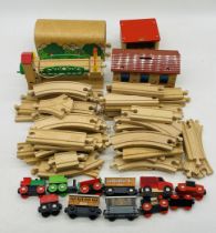 A Brio wooden train set including train, rolling stock, buildings, track etc