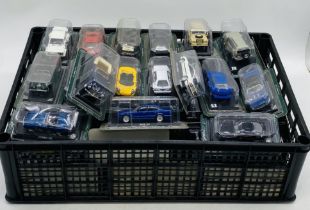 A large collection of die-cast cars including Lamborghini, BMW, Land Rover Defender, Saab, Renault