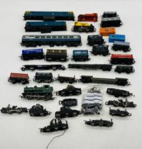 A collection of various OO gauge model railway locomotives, carriage, rolling stock and spare