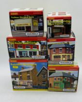 A collection of six boxed Hornby Skaledale OO gauge shops including Radcliffe's Newsagent (R8555),