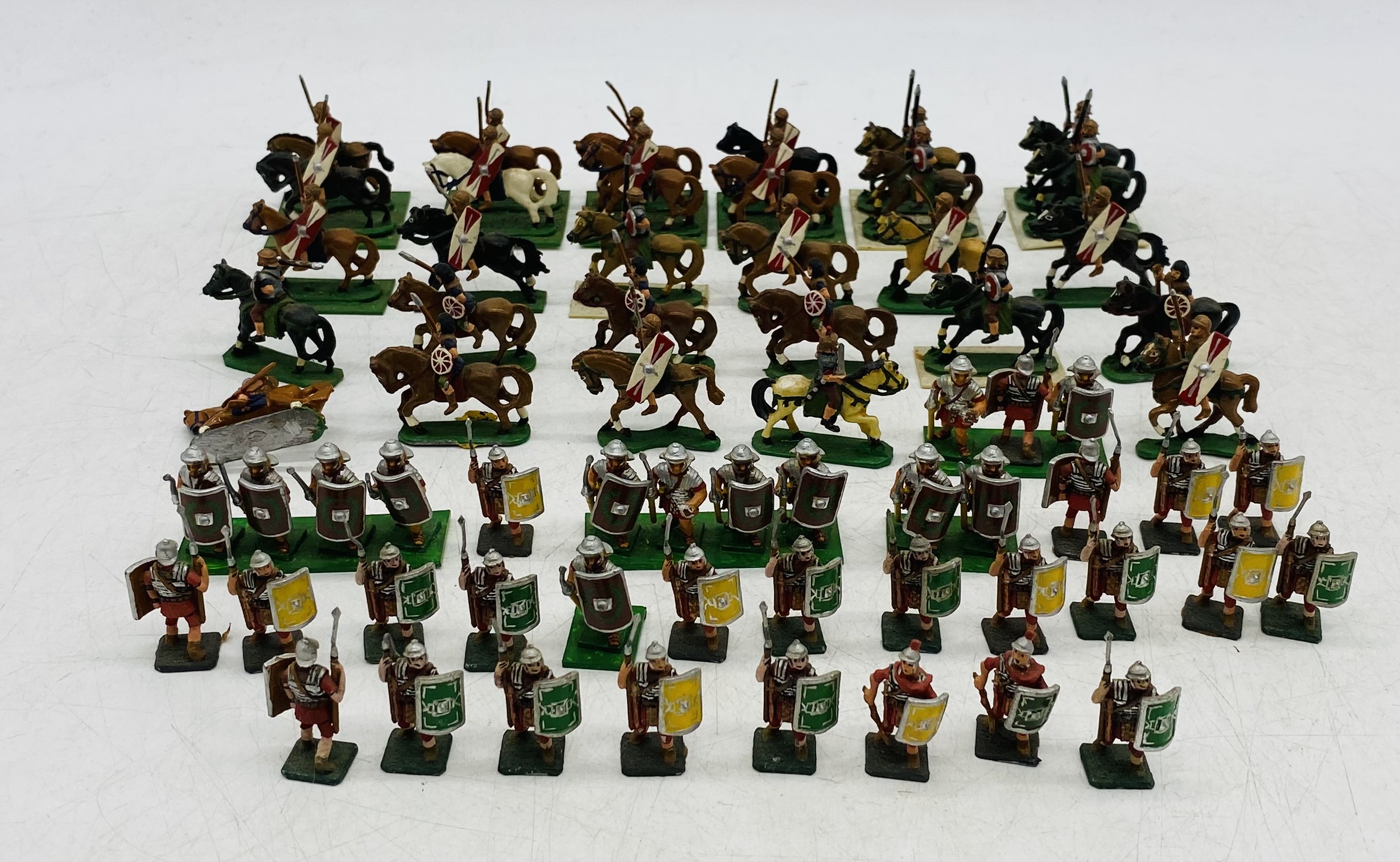 A collection of metal miniature figurines relating to the Roman era including some on horseback