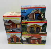 Five boxed Hornby Skaledale OO gauge sheds including Double Engine Shed (R8637), Goods Shed (R8582),