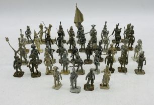 A collection of vintage unpainted Hinton Hunt metal military figurines
