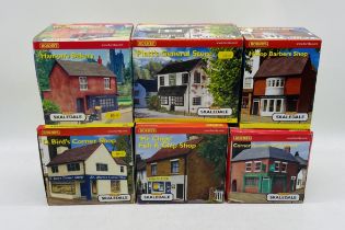 Six boxed Hornby Skaledale OO gauge shops including Hanson's Bakery (R8520), Hislop Barbers Shop (