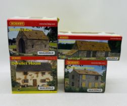 A collection of four boxed Hornby Skaledale OO gauge derelict buildings including Farmhouse (R9646),