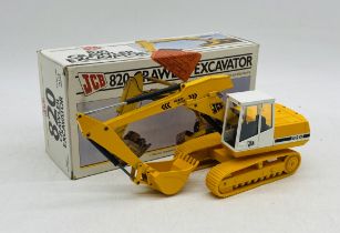 A boxed NZG Models 820 JCB Crawler Excavator die-cast model (1:35 scale - Model No. 246)
