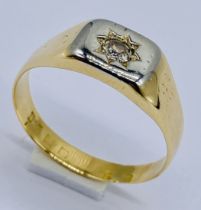 An 18ct gold ring set with a diamond, weight 5.8g, size T 1/2