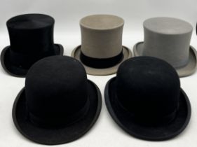 A collection of five top hats and bowler hats including Christys, Moss Bros etc.