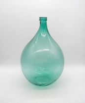 A green glass carboy - height 53cm