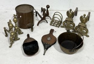 A collection of brass and copper including fire dogs, bellows, coal scoop, jam pan etc.
