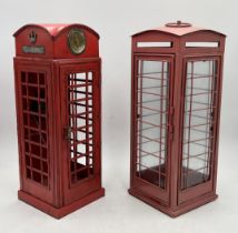 A small reproduction telephone box and a candle holder in similar style