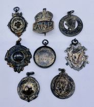 A collection of 1920's silver sporting medallions including three Hurling medals and Exeter football