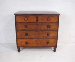 A Victorian stained chest of five drawers, with turned handles, raised on turned feet - length 111.