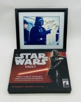 A framed picture of Darth Vader signed by the actor who played him David Prowse, along with The Star