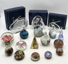 A collection of various paperweights including Mdina etc.