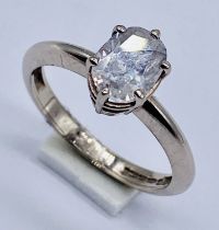 A 18ct white gold diamond solitaire ring set with an oval diamond of approximately 1ct