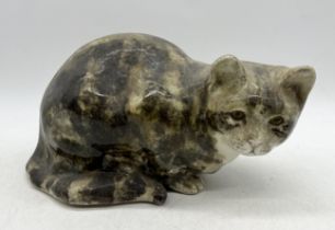 A Winstanley tabby cat in crouched position, size five and signed to base