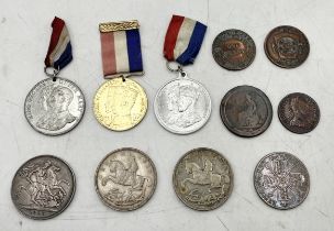 A collection of coinage and medallions including 1893 crown, two 1935 crowns, 1887 double florin