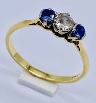 An 18ct gold diamond and sapphire 3 stone ring, size U