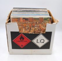 A quantity of various 12" vinyl records, including The Rolling Stones, The Beach Boys, Roxy Music,