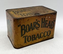 A vintage Boar's Head Tobacco tin