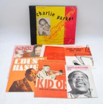 Three jazz 10" shellac records by Charlie Parker and Dizzy Gillespie contained within a Charlie