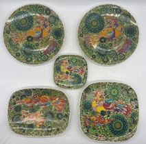 A collection of five Rosenthal plates and chargers in the Paradise Firebird pattern designed by