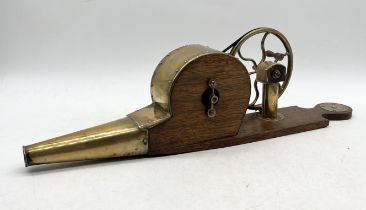 A 19th century pair of brass and wooden mechanical bellows